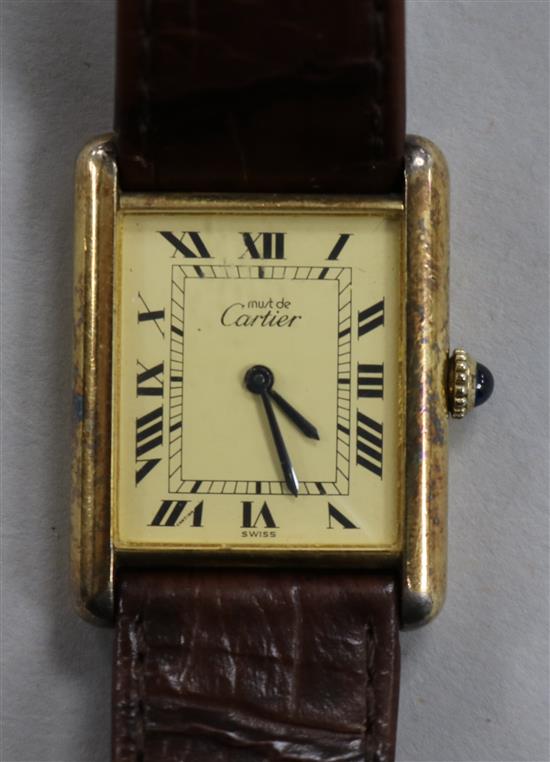 A Must de Cartier silver gilt quartz wrist watch.